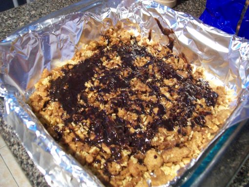 Line a Pyrex with aluminum foil, spray with baking spray (very important!) and spread the crust along the bottom. You can drizzle some melted chocolate on top of this bad boy.
